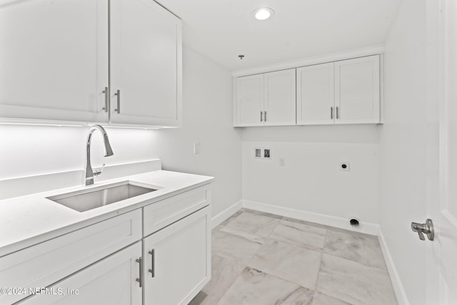 clothes washing area with washer hookup, cabinets, sink, and hookup for an electric dryer