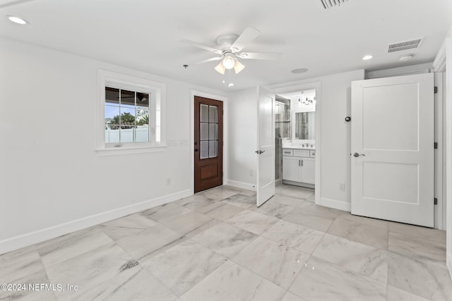 interior space featuring ceiling fan