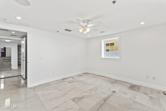 spare room featuring ceiling fan