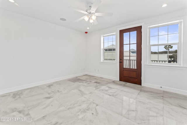 entrance foyer featuring ceiling fan