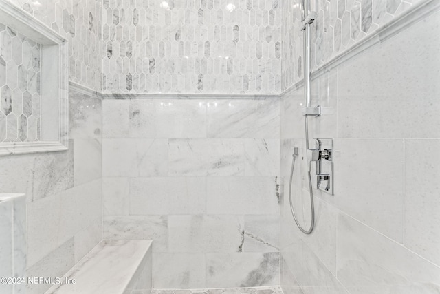 bathroom featuring tiled shower