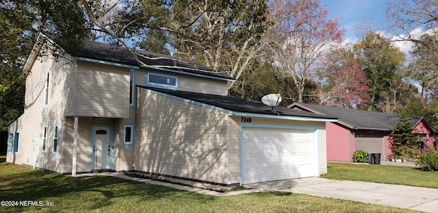 view of home's exterior with a lawn and a garage