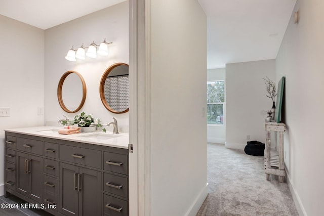 bathroom featuring dual vanity