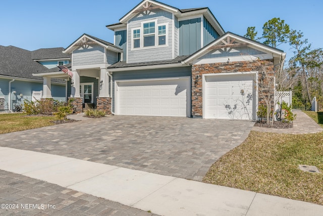 craftsman house with a garage