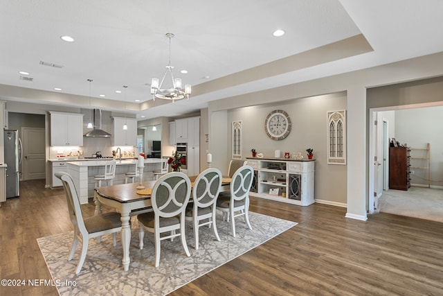 dining space featuring baseboards, visible vents, recessed lighting, dark wood-type flooring, and a chandelier