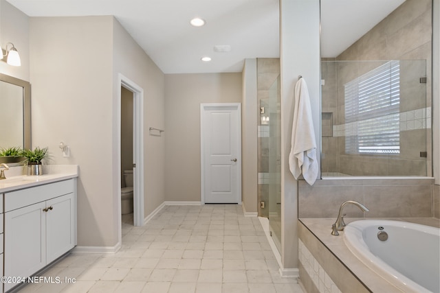 full bathroom with a garden tub, toilet, a stall shower, baseboards, and vanity