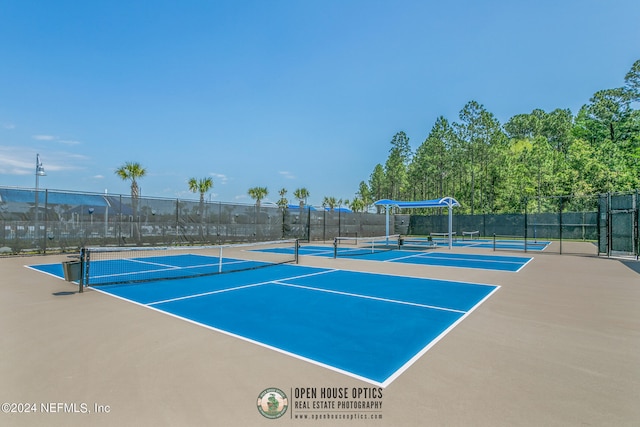 view of tennis court with fence