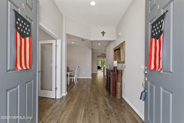 entryway with recessed lighting, baseboards, and wood finished floors