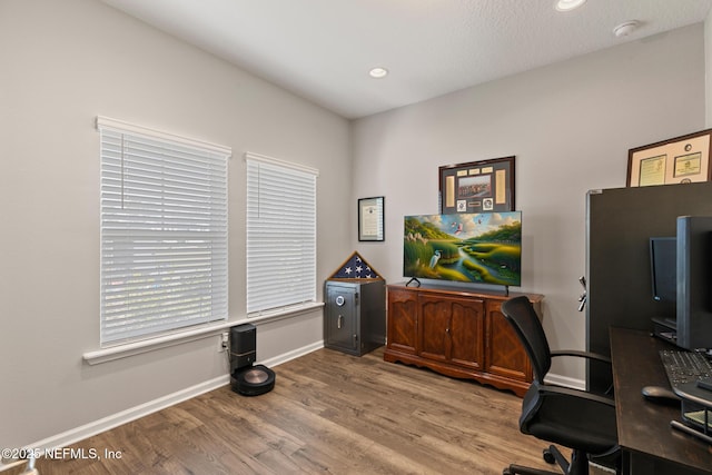 home office featuring recessed lighting, baseboards, and wood finished floors