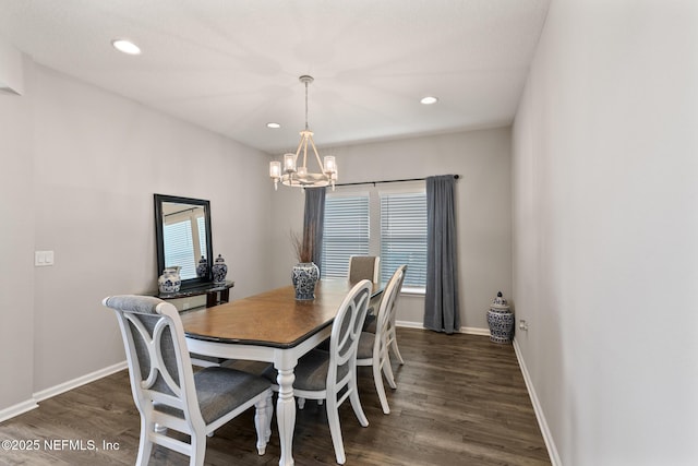 dining area featuring recessed lighting, wood finished floors, baseboards, and a chandelier