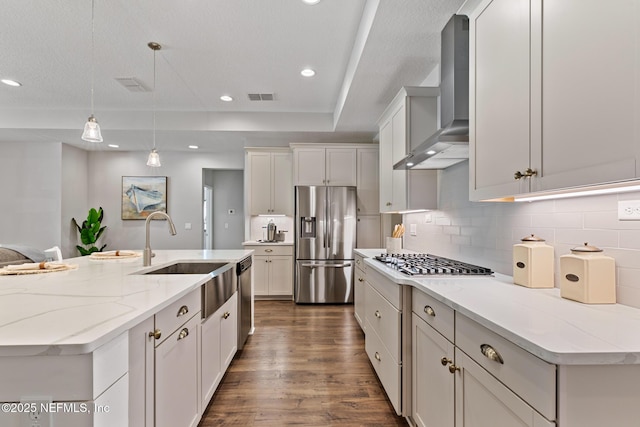 kitchen with visible vents, tasteful backsplash, stainless steel appliances, wall chimney range hood, and dark wood-style flooring