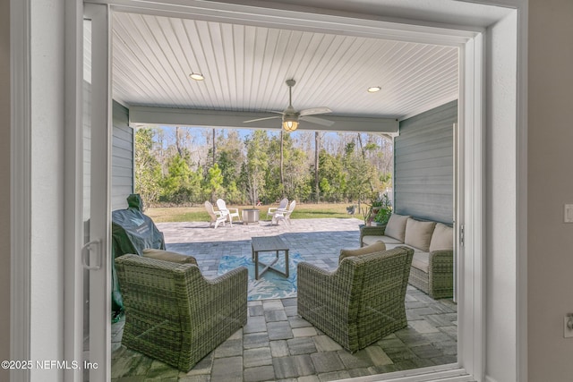 view of patio featuring an outdoor hangout area and ceiling fan