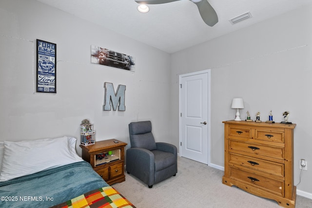 bedroom with a ceiling fan, light colored carpet, visible vents, and baseboards