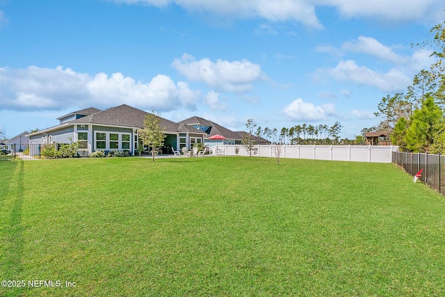 view of yard featuring a fenced backyard