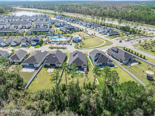 bird's eye view featuring a residential view and a water view