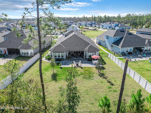 birds eye view of property with a residential view