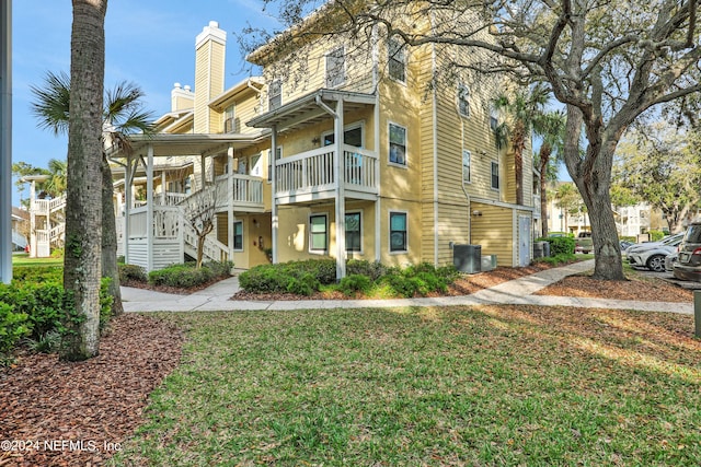 view of property featuring central AC unit