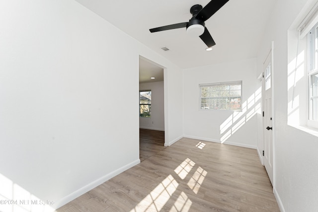 unfurnished room with light hardwood / wood-style floors and ceiling fan