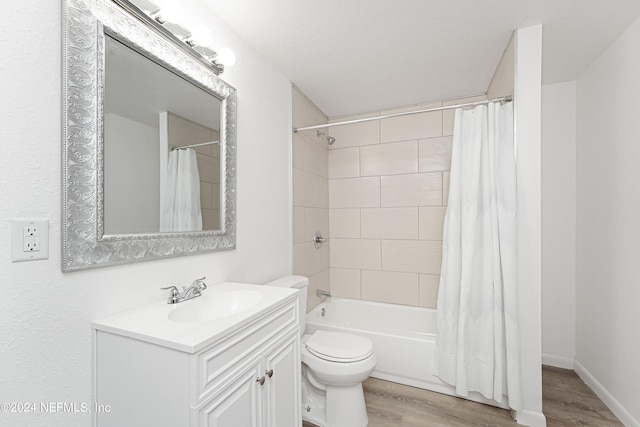 full bathroom featuring toilet, vanity, shower / tub combo with curtain, and hardwood / wood-style flooring