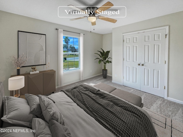 bedroom with a closet, carpet, a ceiling fan, and baseboards