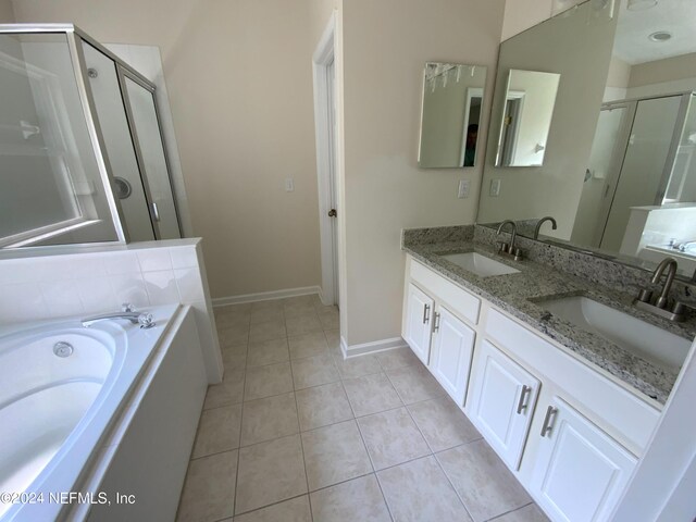 bathroom featuring dual bowl vanity, independent shower and bath, and tile patterned flooring