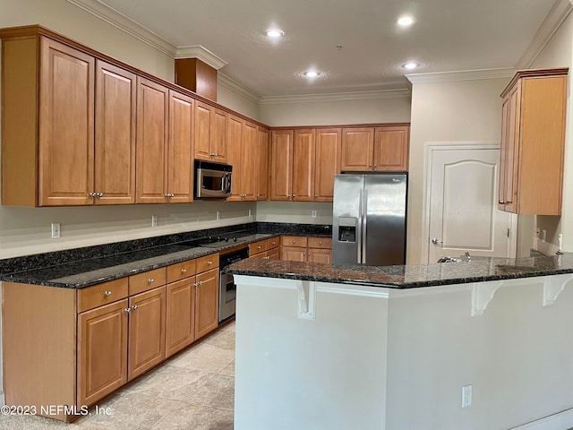 kitchen with light tile flooring, kitchen peninsula, stainless steel appliances, crown molding, and dark stone countertops