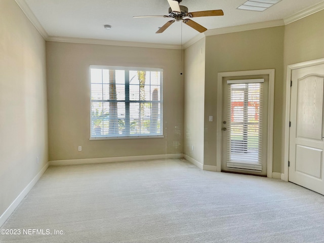 empty room with light carpet, ornamental molding, and ceiling fan