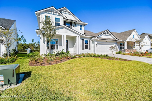 craftsman inspired home with a garage, a front lawn, and a porch