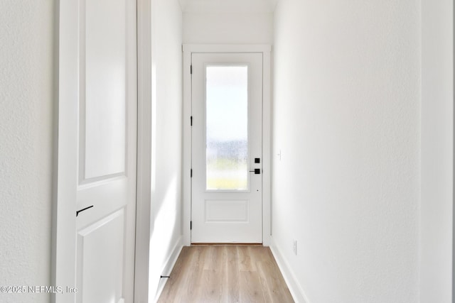 doorway with light hardwood / wood-style floors