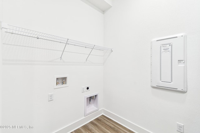 laundry room featuring washer hookup, hardwood / wood-style floors, and hookup for an electric dryer