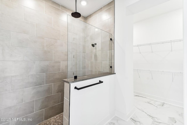 bathroom with tiled shower