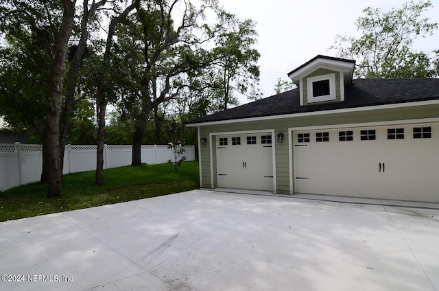 garage featuring a yard