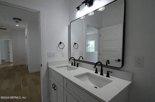 bathroom featuring hardwood / wood-style floors and vanity