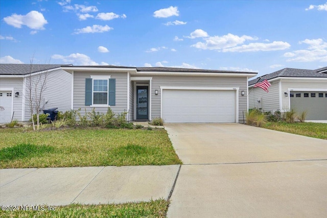 single story home with a front yard and a garage