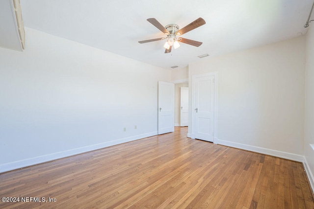 unfurnished room with light hardwood / wood-style flooring and ceiling fan