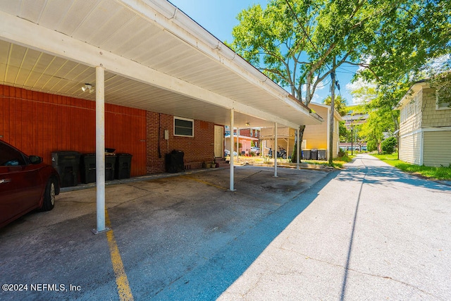 view of vehicle parking featuring a carport