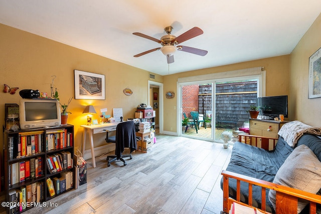 office with ceiling fan and light wood-type flooring