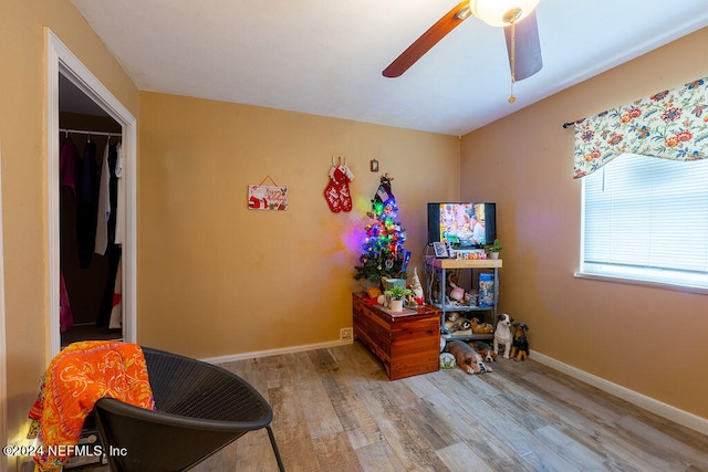 bedroom with a closet, ceiling fan, and light wood-type flooring