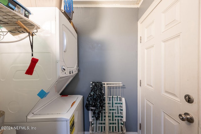 laundry area featuring stacked washer and dryer