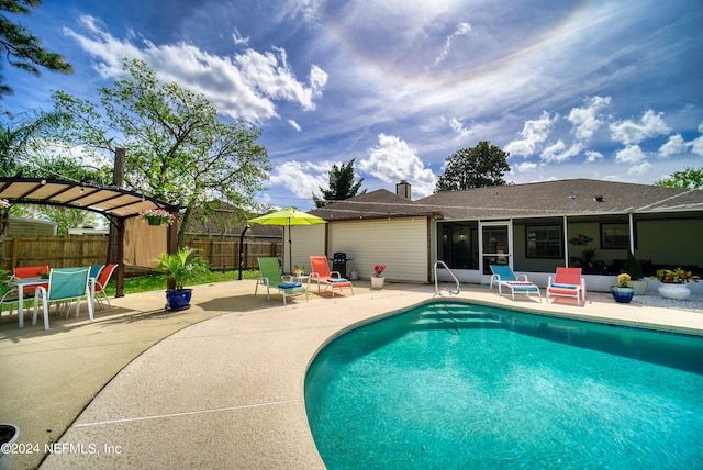 view of swimming pool with a patio