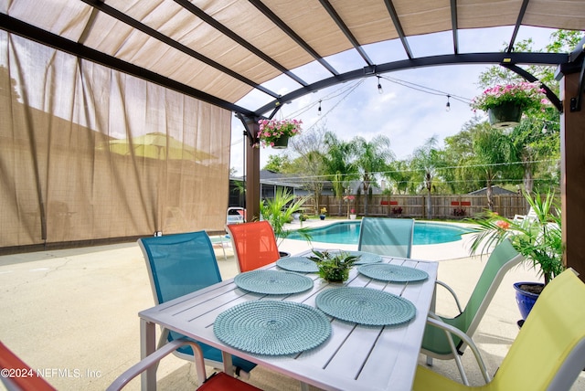 view of patio with a pergola and a fenced in pool