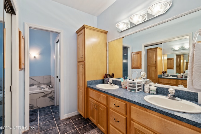 bathroom featuring oversized vanity, a relaxing tiled bath, dual sinks, and tile flooring