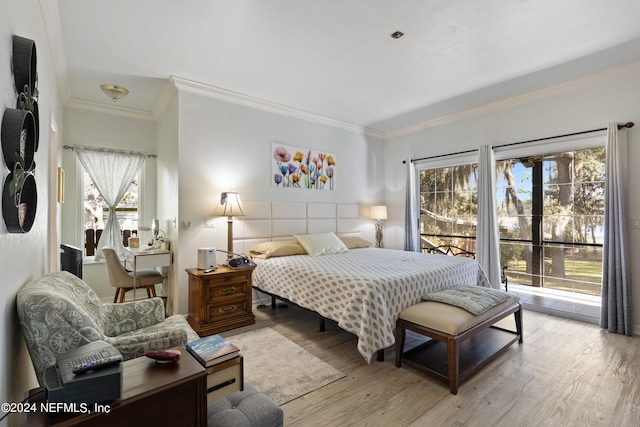 bedroom featuring ornamental molding, access to outside, and light wood-type flooring