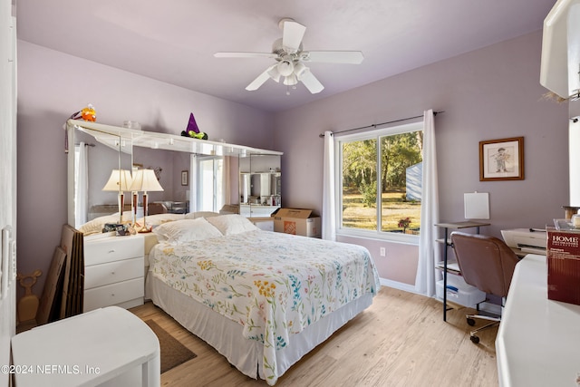 bedroom featuring ceiling fan and light wood-type flooring