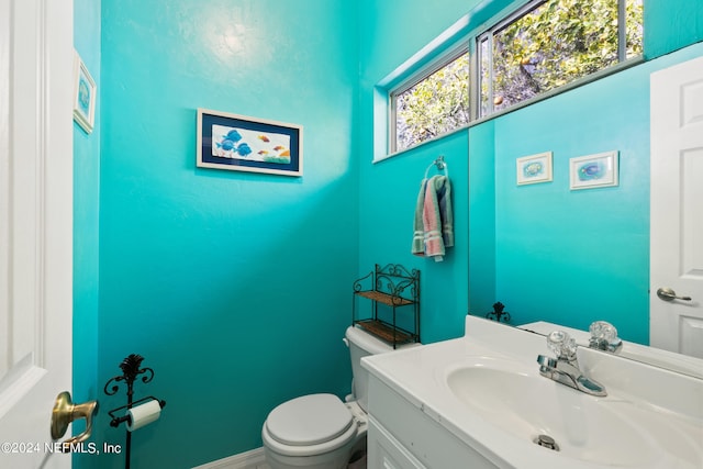 bathroom with oversized vanity and toilet