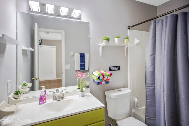 full bathroom featuring vanity, toilet, and shower / bath combo with shower curtain