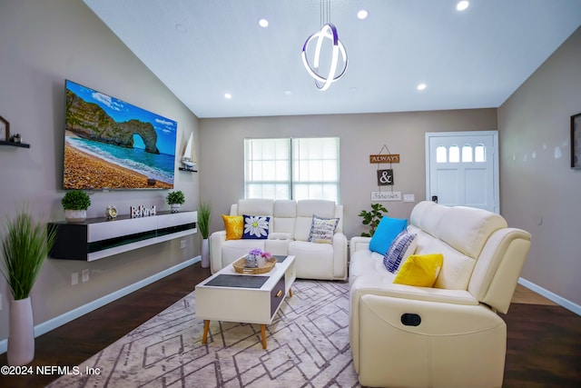 living room with hardwood / wood-style flooring and vaulted ceiling