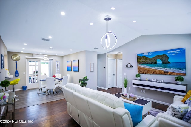 living room featuring dark hardwood / wood-style flooring and vaulted ceiling