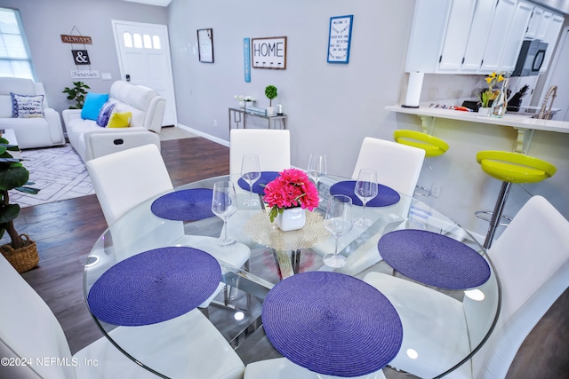 dining area featuring hardwood / wood-style flooring