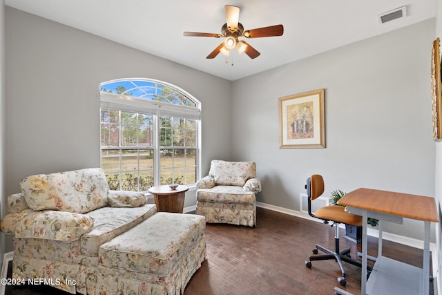 home office featuring ceiling fan and dark wood-type flooring